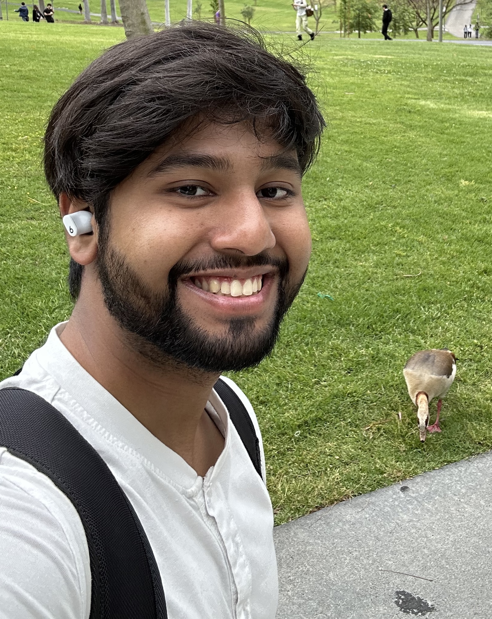 Farhan Zaman smiling outdoors